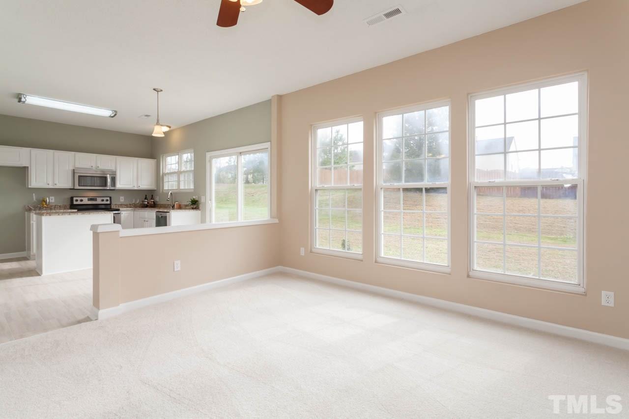 2929 Ranburne Drive Raleigh, NC 27610 - Photo 8 of 22 a view of a kitchen with microwave and windows