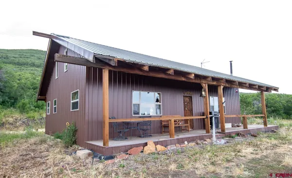 a backyard of a house with seating space