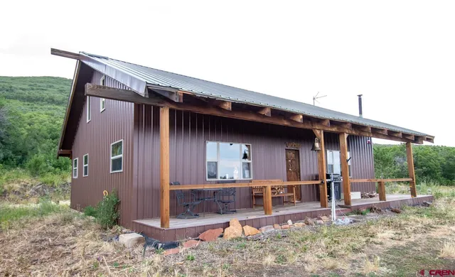 a backyard of a house with seating space