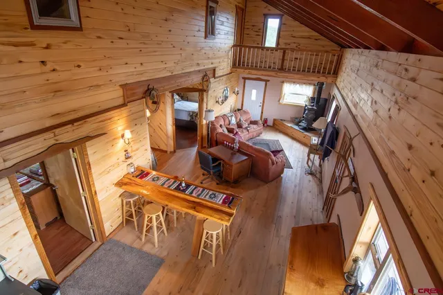 a view of living room with furniture and a fireplace