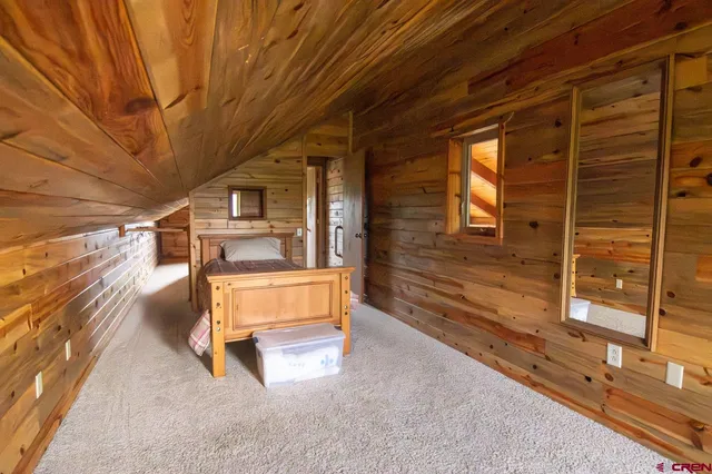 a bedroom with a bed and a walk in closet