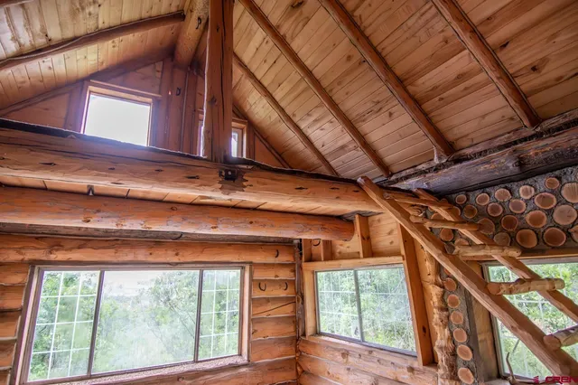 a view of a room with wooden walls