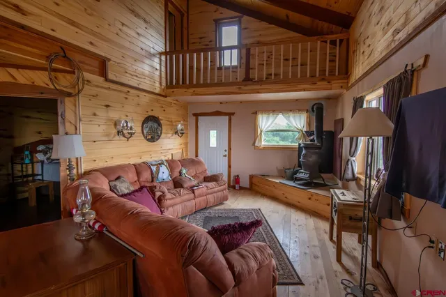 a living room with furniture a window and a fireplace