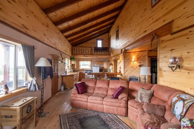 a living room with furniture fireplace and a window