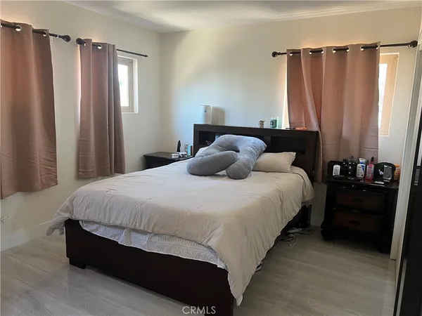 a bedroom with bed and a closet