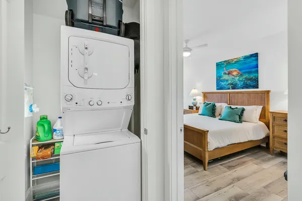 a bedroom with a bed and a painting on the wall