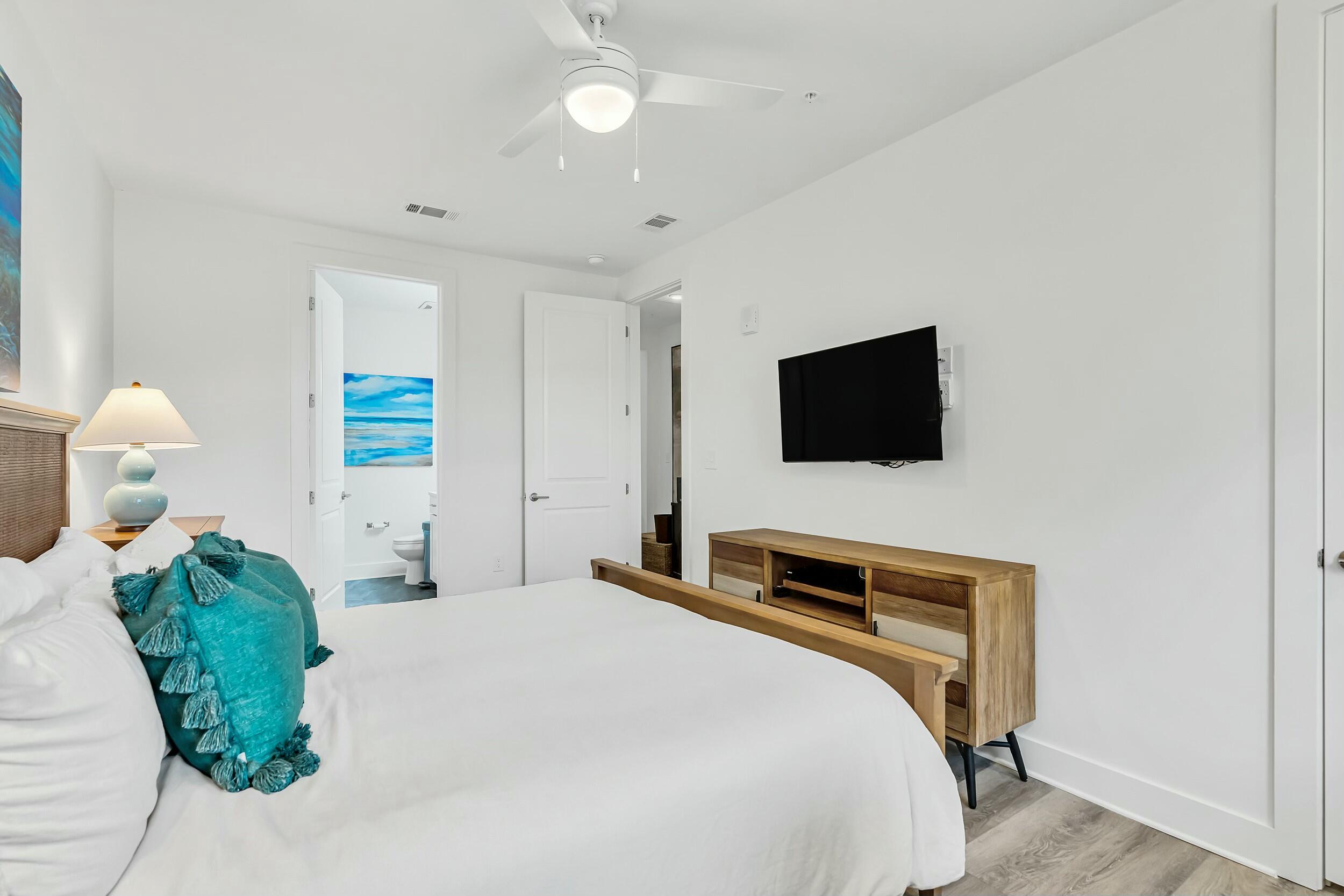 179 South County Highway 393, Unit 445 Santa Rosa Beach, FL 32459 - Photo 15 of 50 a bedroom with a bed and a flat screen tv