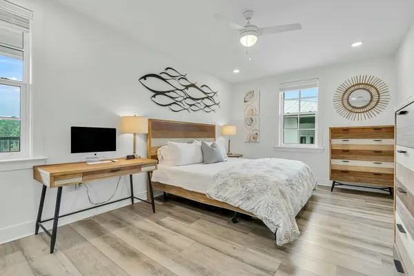 a bedroom with a bed and a television