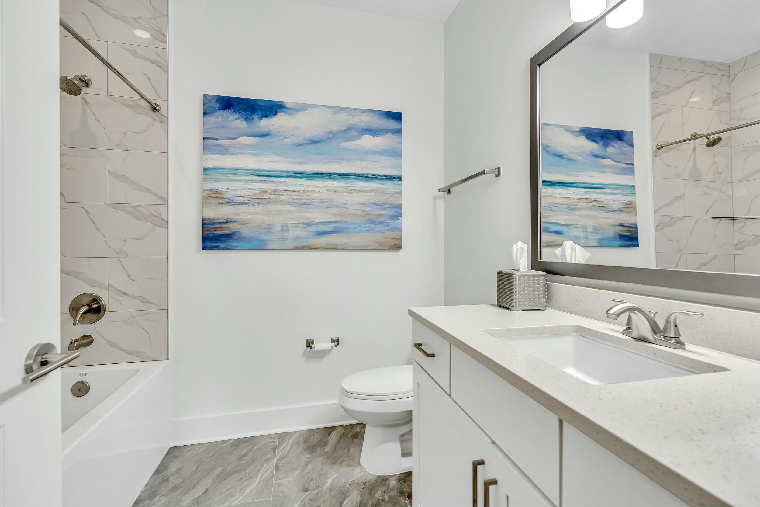179 South County Highway 393, Unit 445 Santa Rosa Beach, FL 32459 - Photo 19 of 50 a bathroom with a sink a toilet and shower