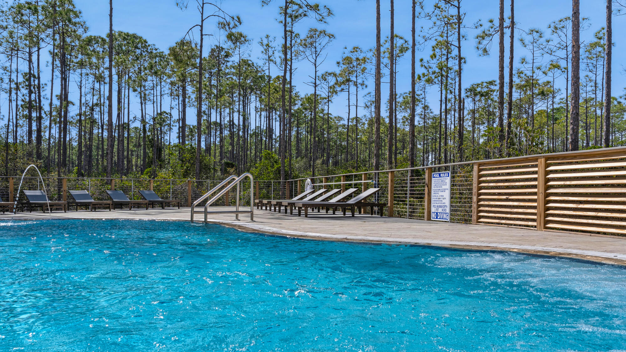 179 South County Highway 393, Unit 445 Santa Rosa Beach, FL 32459 - Photo 23 of 50 a view of a park with swings and slides