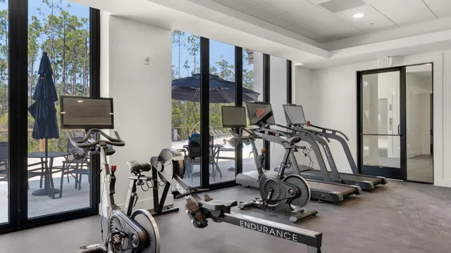 a large kitchen with a sink and a refrigerator