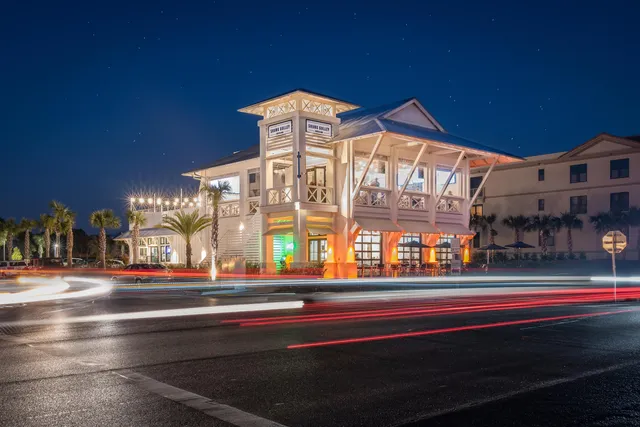 a bird view of house and outdoor space