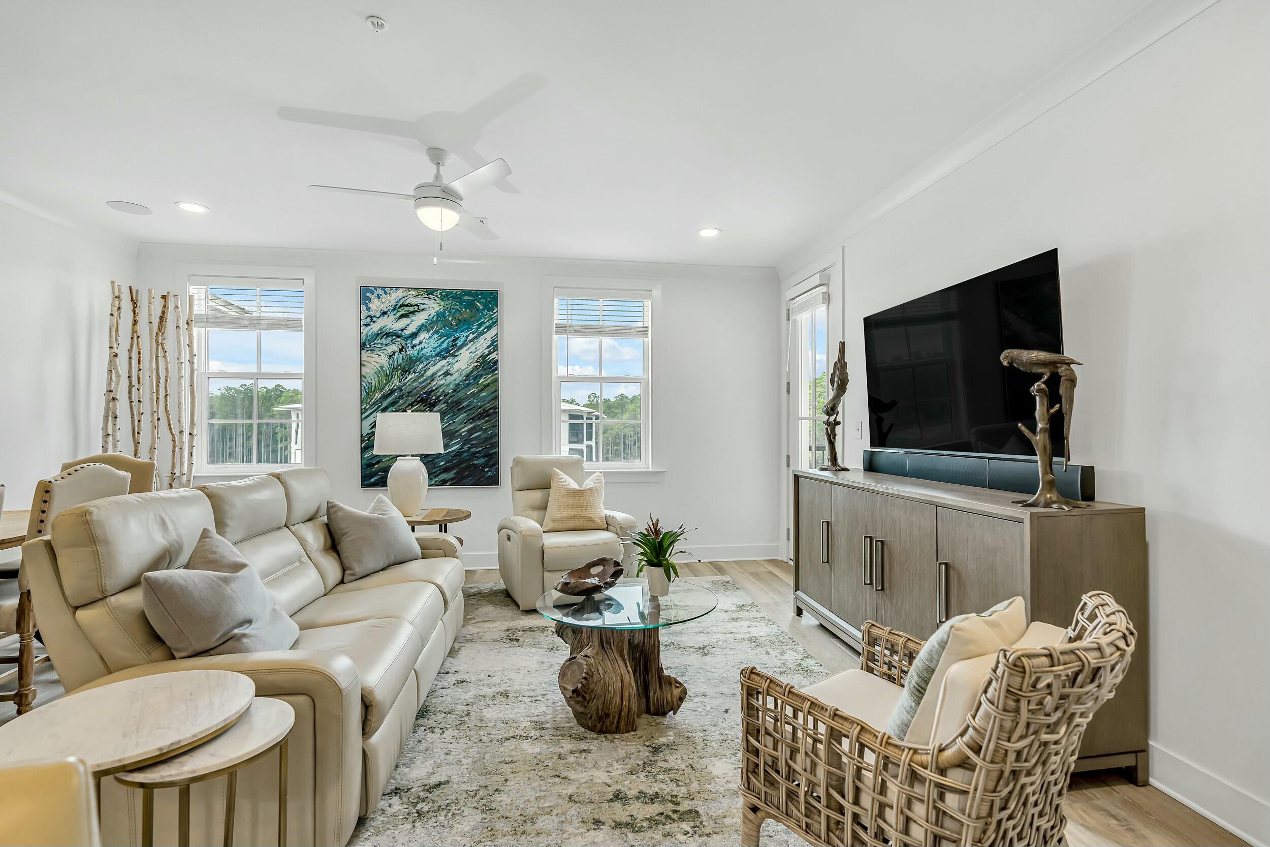 179 South County Highway 393, Unit 445 Santa Rosa Beach, FL 32459 - Photo 8 of 50 a living room with furniture and a flat screen tv