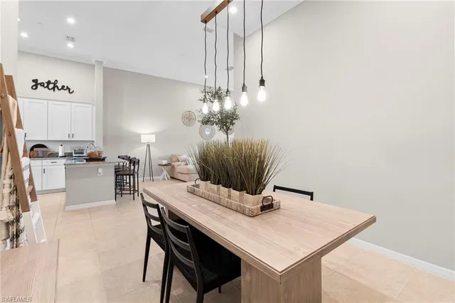 an aerial view of a house with a swimming pool and garden