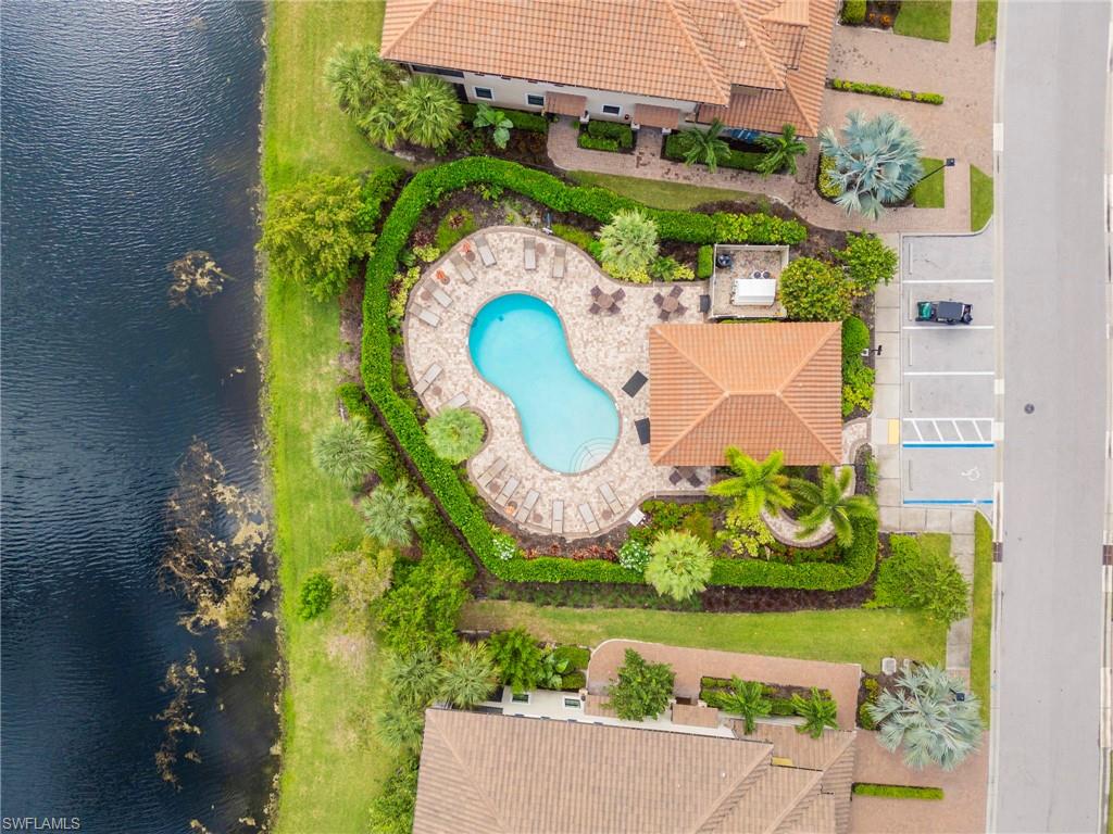 9402 Pocida Court, Unit 202 Naples, FL 34119 - Photo 27 of 31 Drone / aerial view of a large body of water and a pool