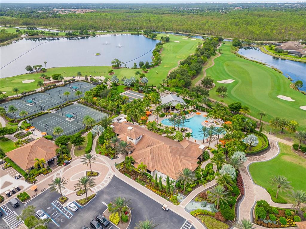 9402 Pocida Court, Unit 202 Naples, FL 34119 - Photo 29 of 31 Drone / aerial view of a golf course and a nearby body of water