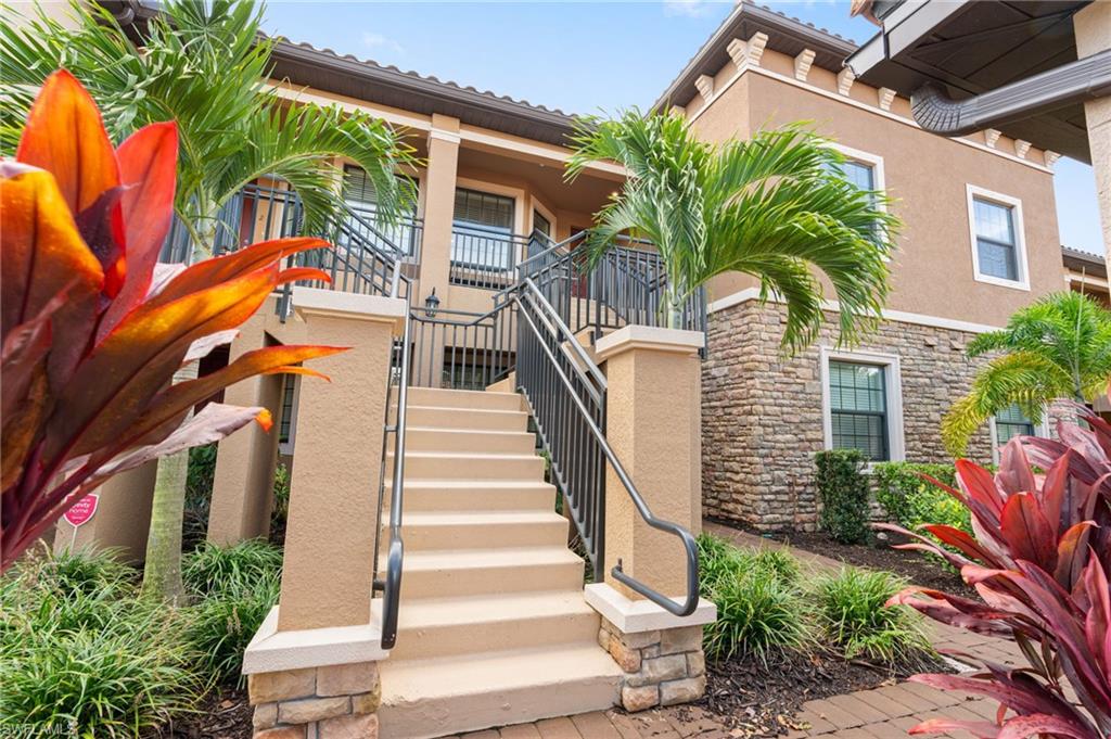 9402 Pocida Court, Unit 202 Naples, FL 34119 - Photo 3 of 31 View of property featuring stairway