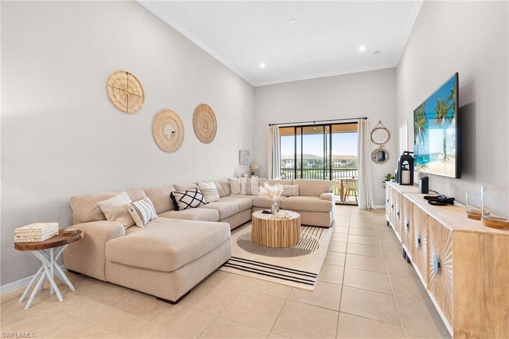 9402 Pocida Court, Unit 202 Naples, FL 34119 - Photo 8 of 31 Living area featuring ornamental molding, light tile patterned floors, and recessed lighting