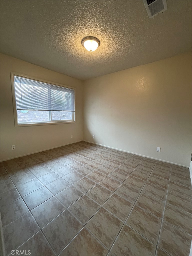 1250 I Merced, CA 95341 - Photo 6 of 9 an empty room with windows and entrance