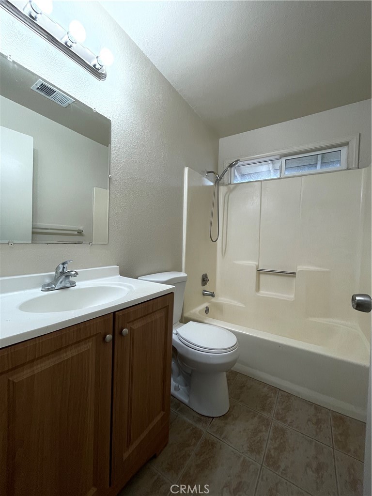 1250 I Merced, CA 95341 - Photo 8 of 9 a bathroom with a double vanity sink toilet and shower