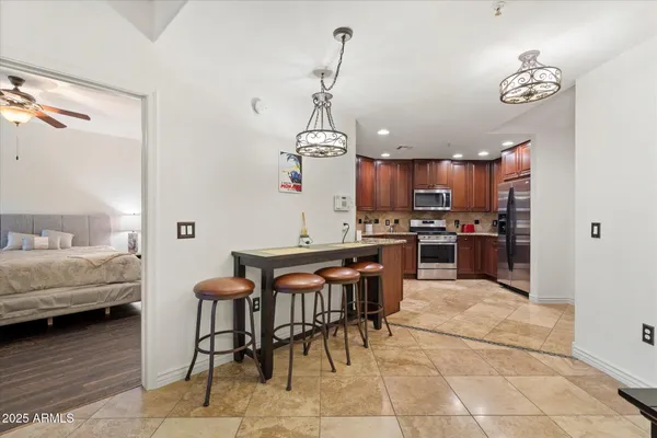 a living room with furniture and kitchen view