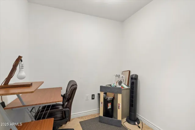 a view of a workspace with furniture