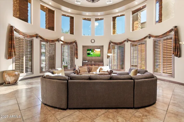 a room with pool table and windows