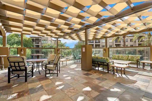 a building outdoor space with patio furniture and potted plants