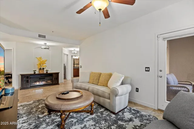 a living room with furniture and a rug