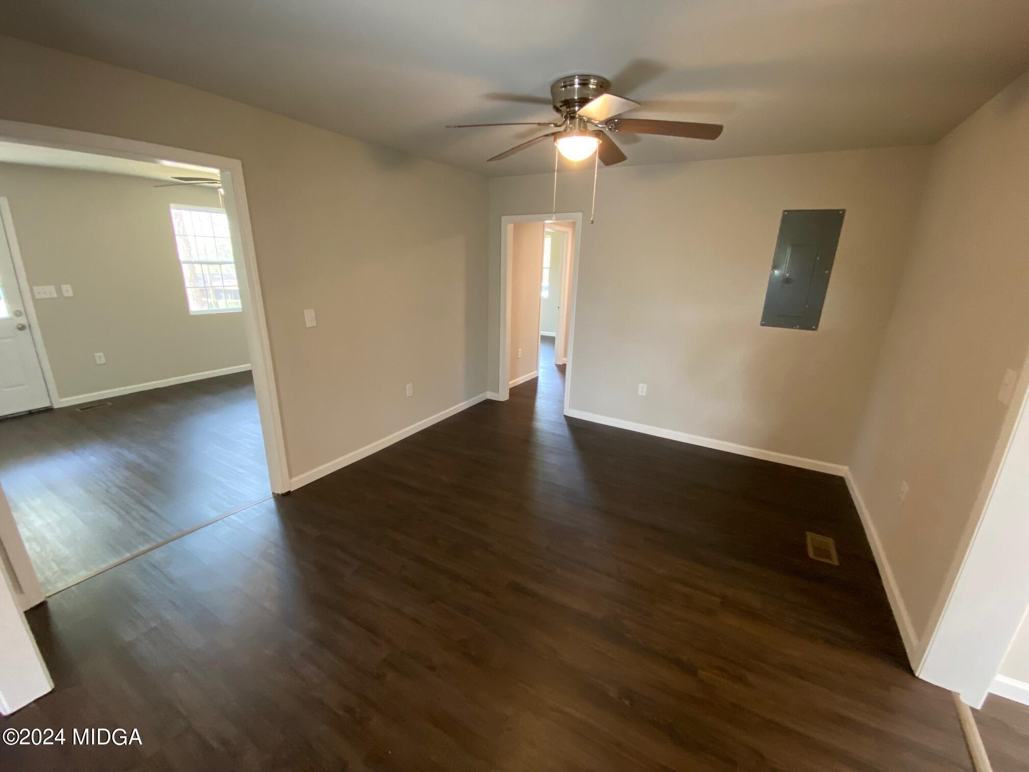4548 Massey Road Macon, GA 31206 - Photo 8 of 27 a view of an empty room with wooden floor and a window