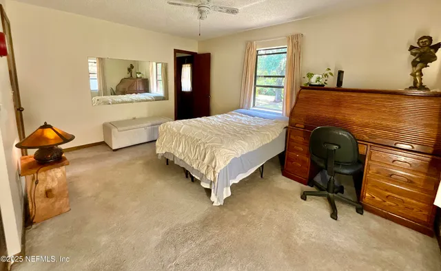 a bedroom with a bed and a cabinets