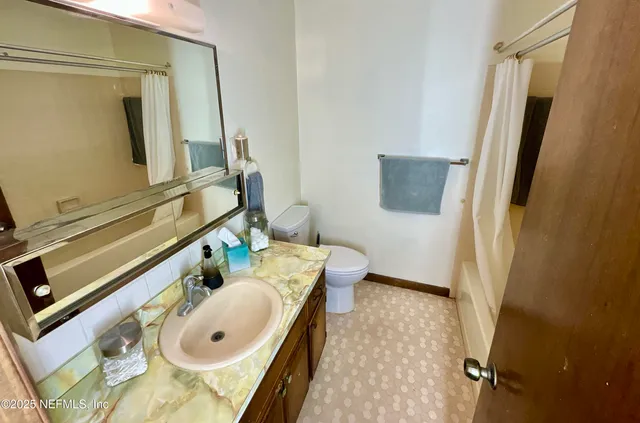 a bathroom with a tub and a shower