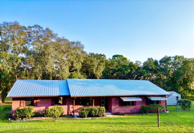 a view of a house with a yard porch and sitting area
