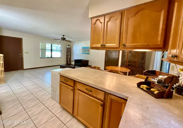 a room with pool table and window