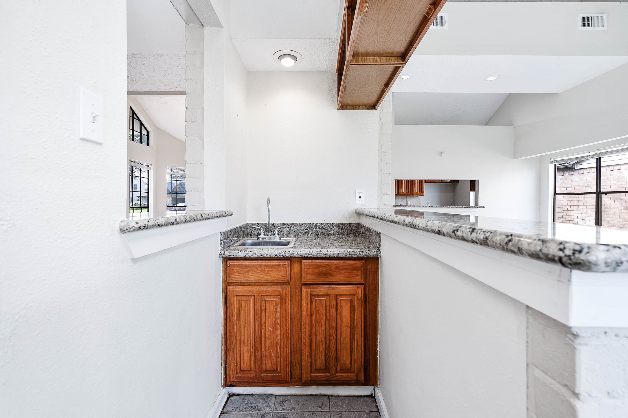 2015 Echo Ridge Sugar Land, TX 77478 - Photo 15 of 29 a kitchen with stainless steel appliances granite countertop a sink and a stove with wooden floor
