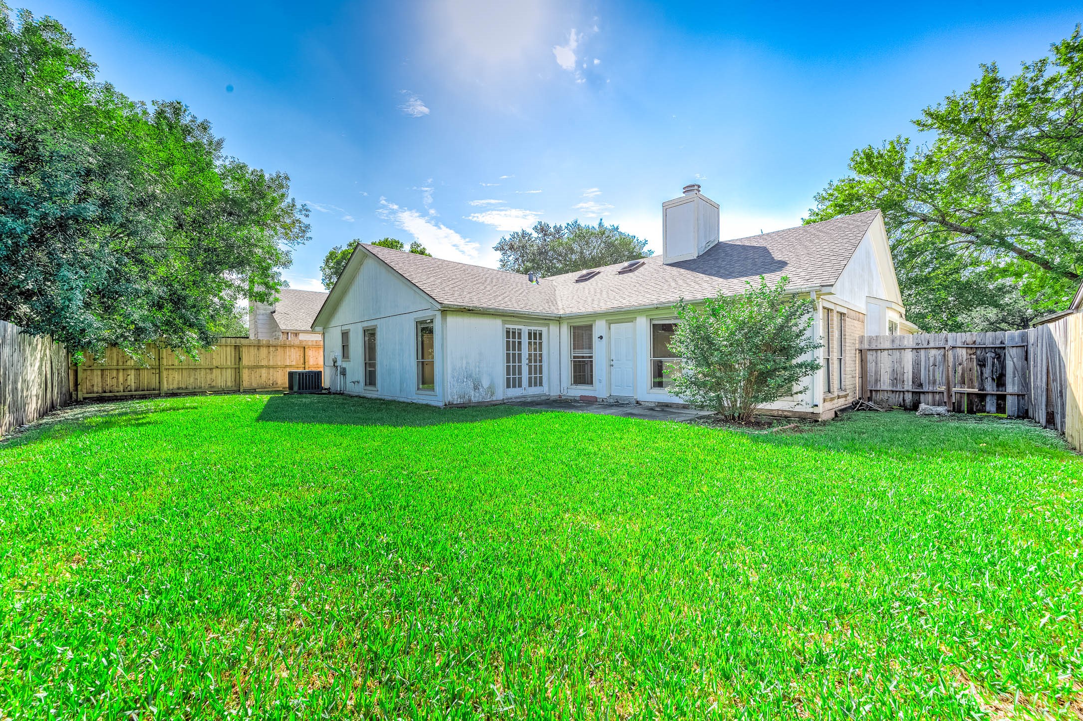 2015 Echo Ridge Sugar Land, TX 77478 - Photo 27 of 29 a view of a house with backyard and porch