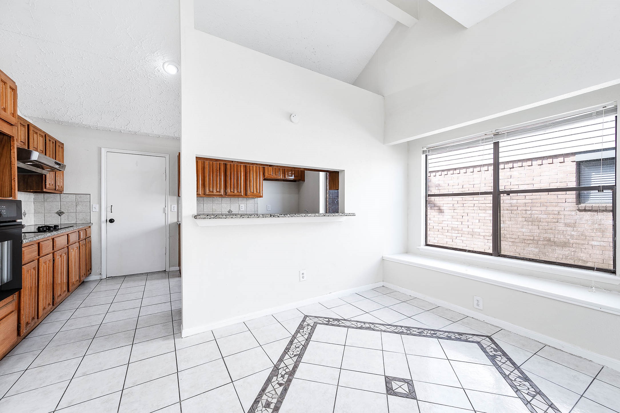 2015 Echo Ridge Sugar Land, TX 77478 - Photo 9 of 29 a view of a kitchen with a sink and dishwasher with wooden floor