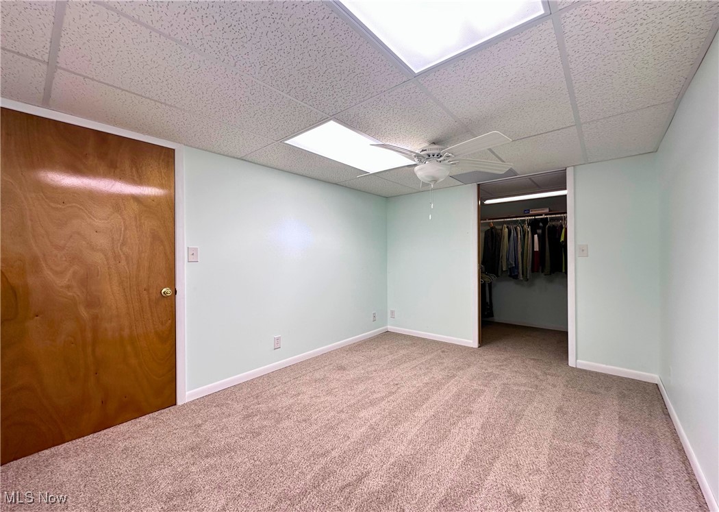 157 Birch Road Painesville, OH 44077 - Photo 24 of 41 Unfurnished bedroom-type room with carpet, a paneled ceiling, baseboards, and a closet