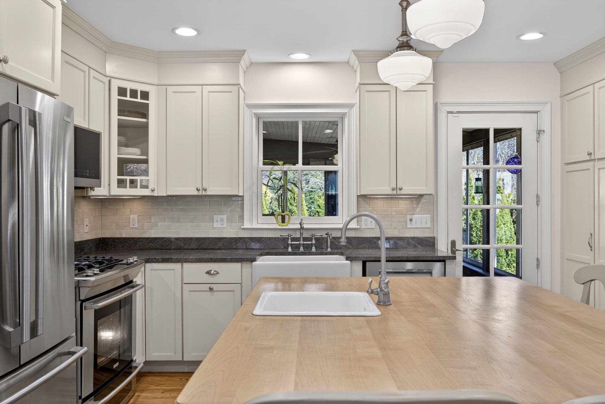 474 Davisville Road East Falmouth, MA 02536 - Photo 14 of 66 a kitchen with stainless steel appliances granite countertop a stove a sink and a refrigerator
