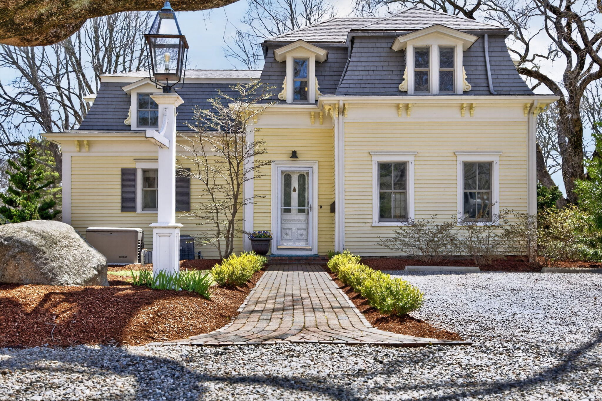 474 Davisville Road East Falmouth, MA 02536 - Photo 2 of 66 a front view of a house with garden