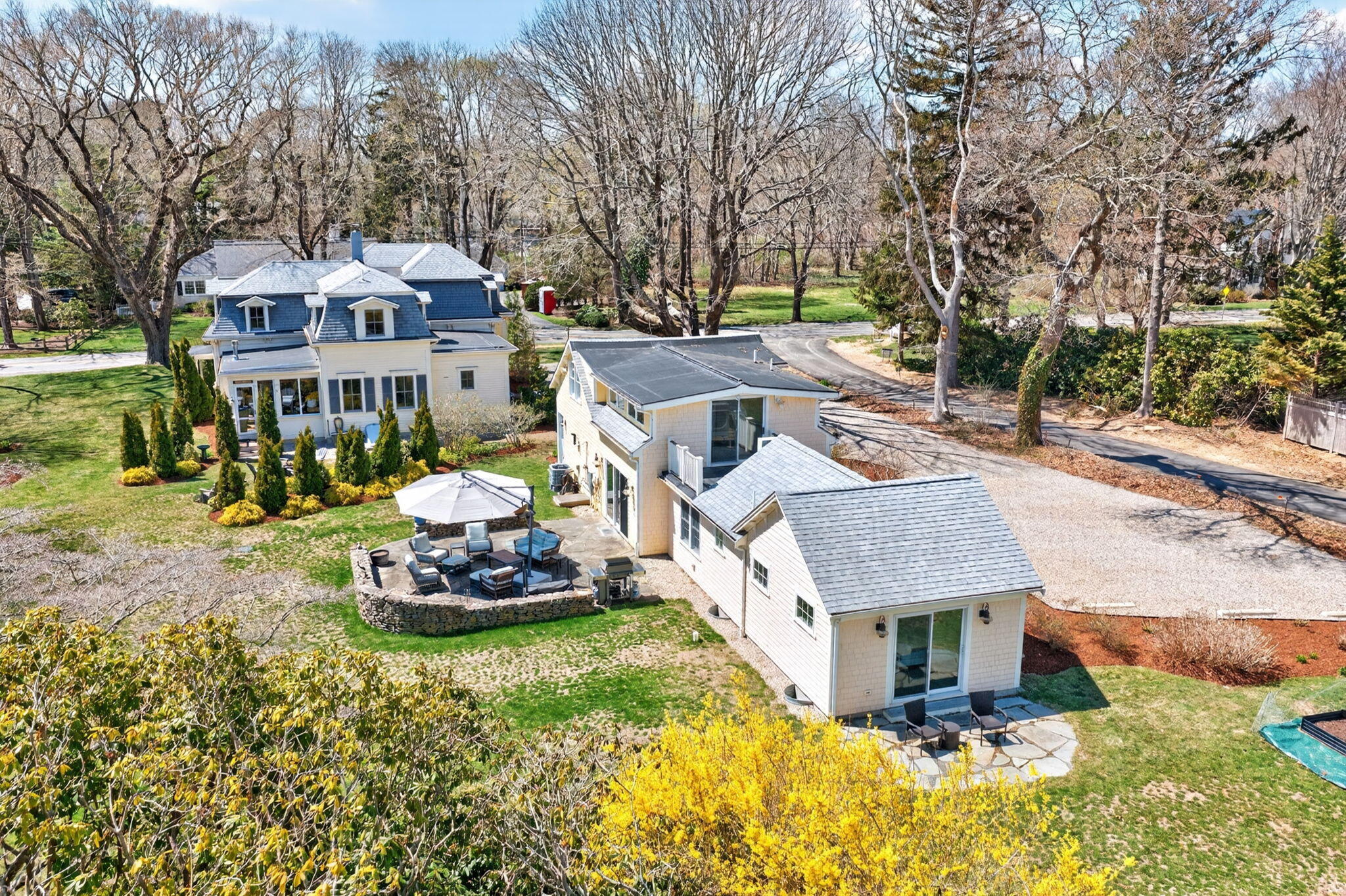 474 Davisville Road East Falmouth, MA 02536 - Photo 3 of 66 a front view of a house with a yard and fountain