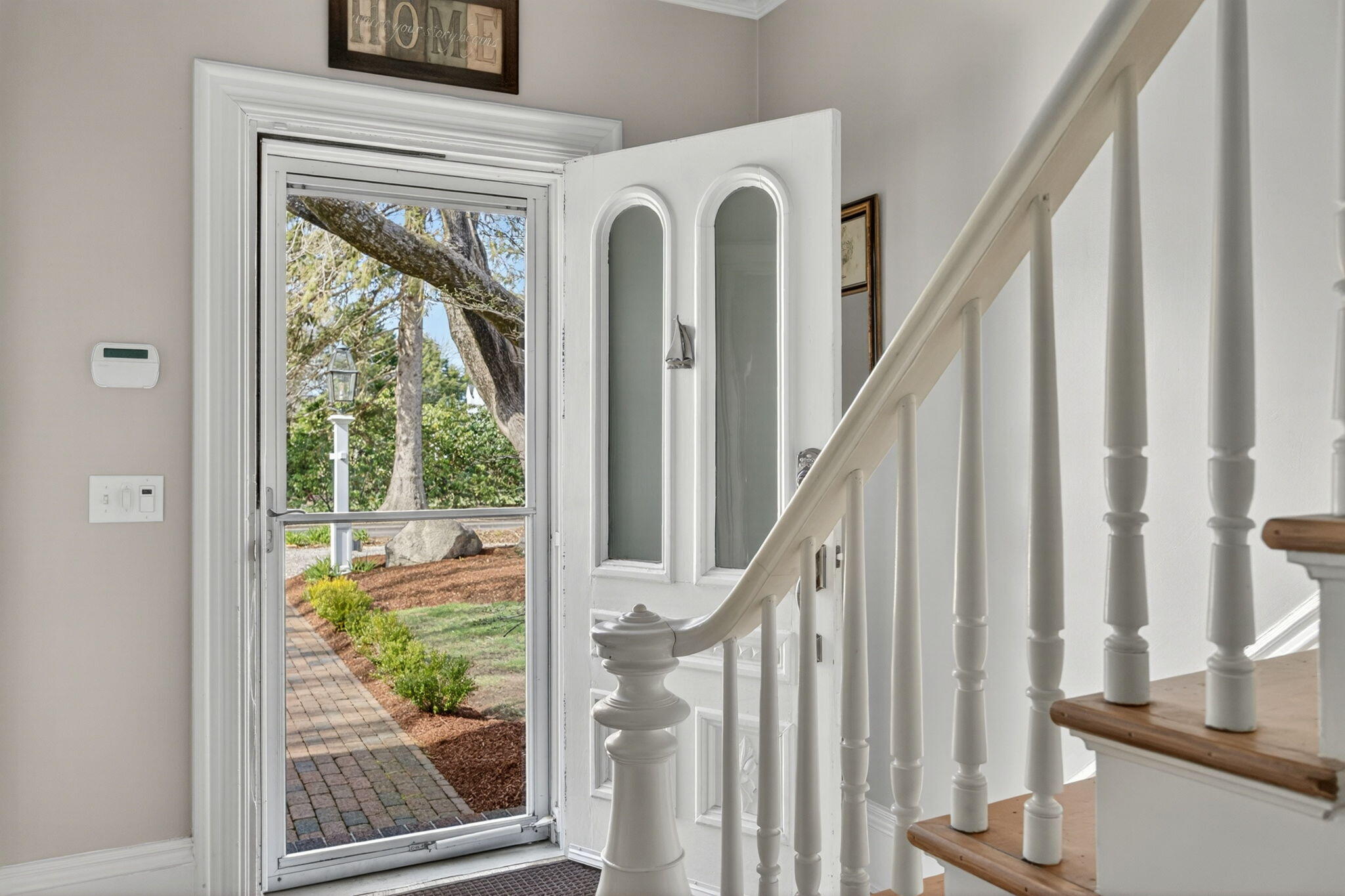 474 Davisville Road East Falmouth, MA 02536 - Photo 36 of 66 a view of staircase with wooden floor and a large window