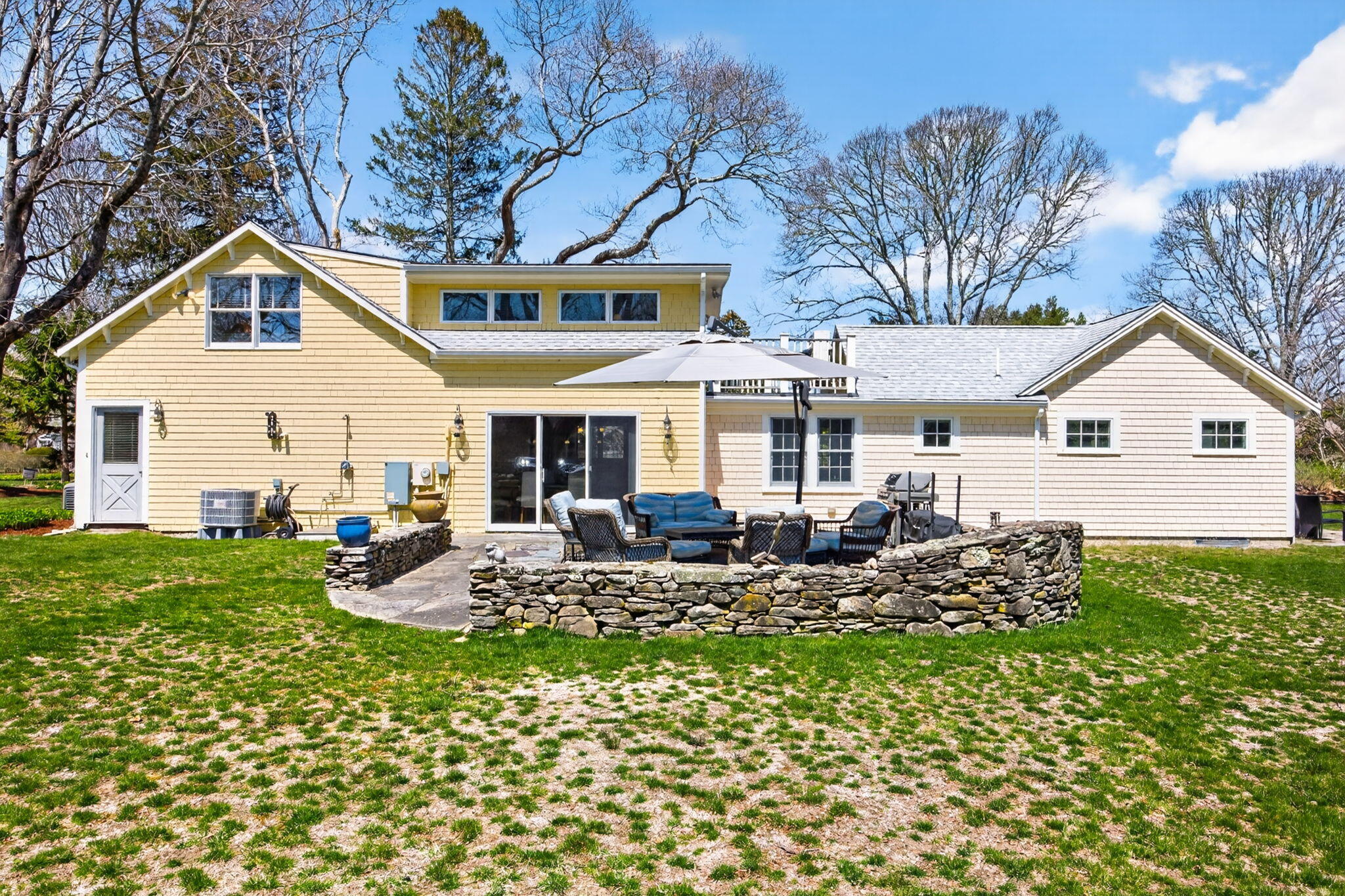 474 Davisville Road East Falmouth, MA 02536 - Photo 37 of 66 a view of a house with backyard sitting area and garden