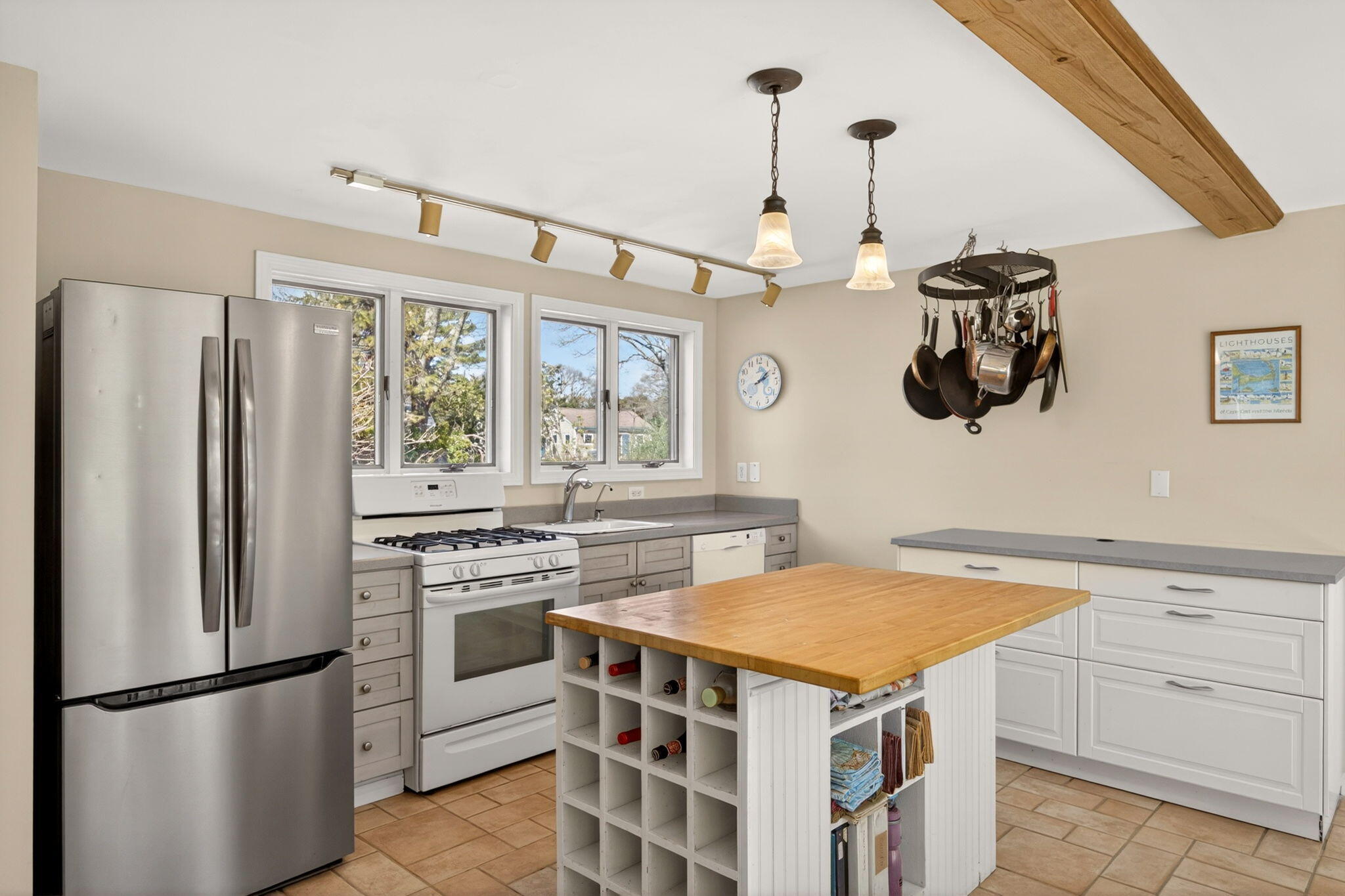 474 Davisville Road East Falmouth, MA 02536 - Photo 40 of 66 a kitchen with a stove a refrigerator and a sink