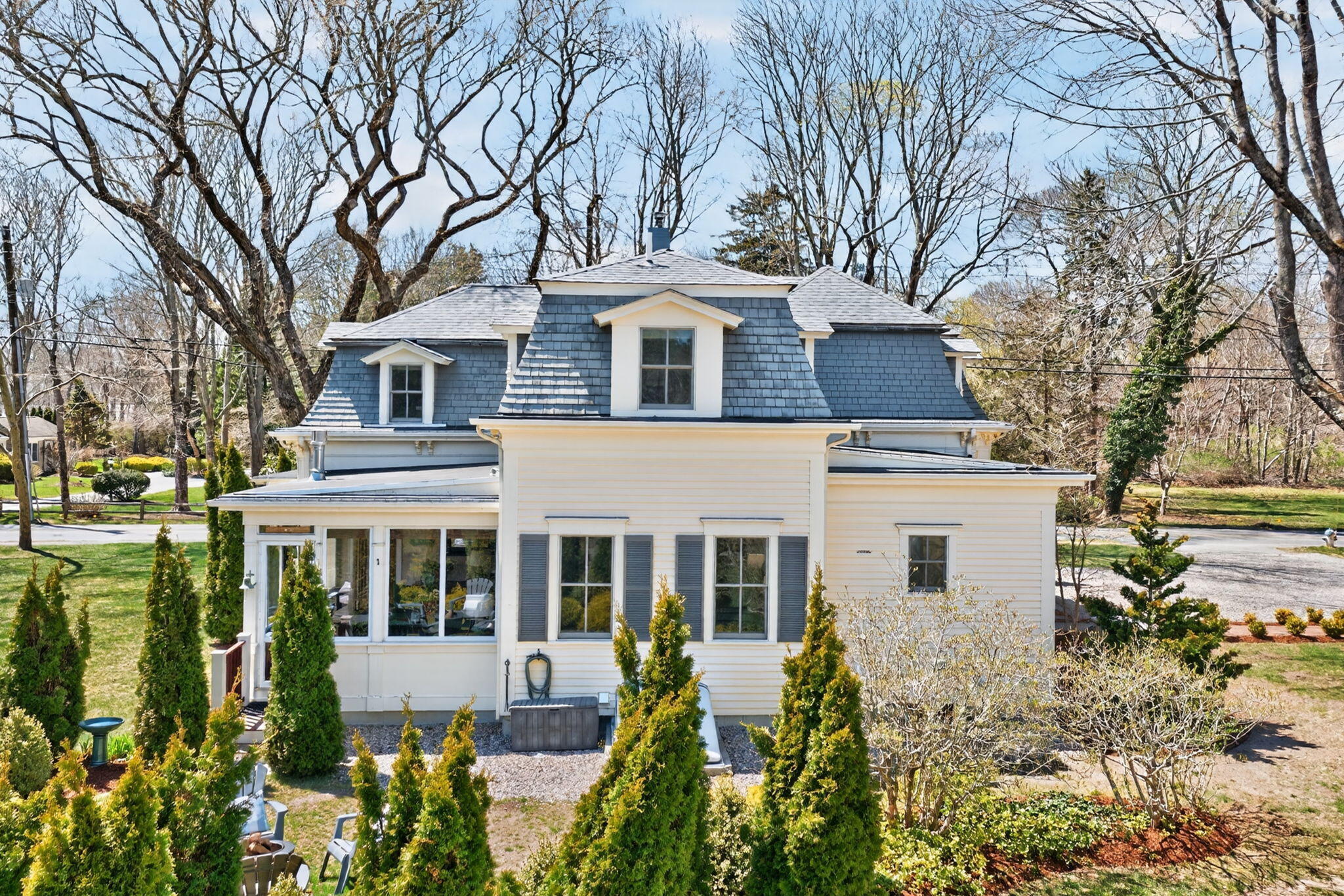 474 Davisville Road East Falmouth, MA 02536 - Photo 51 of 66 a front view of a house with a garden