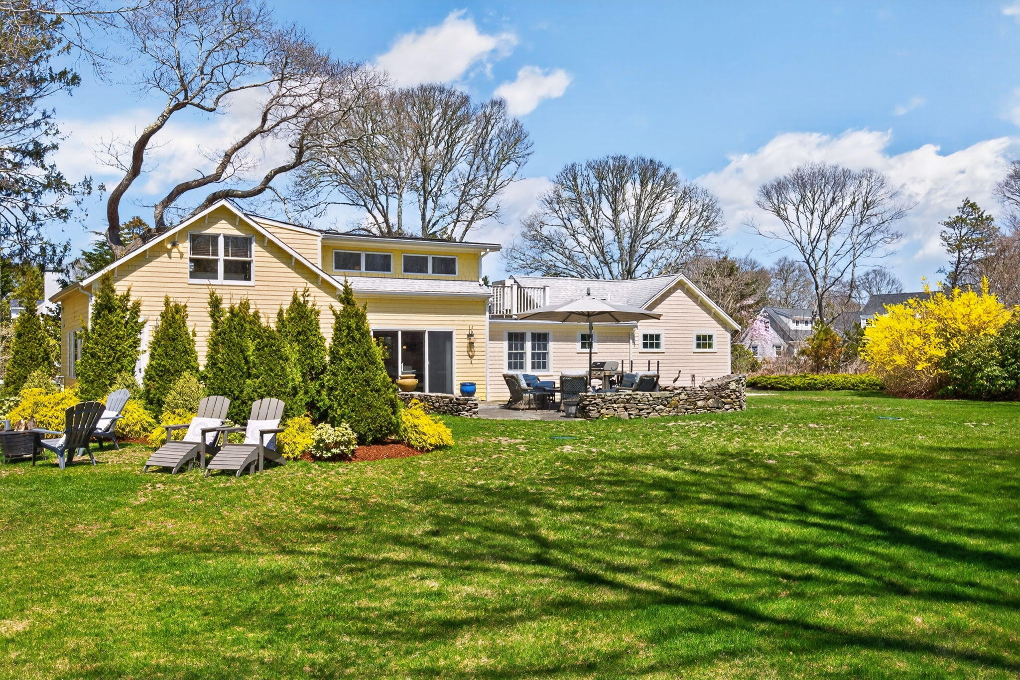 474 Davisville Road East Falmouth, MA 02536 - Photo 56 of 66 a front view of a house with garden
