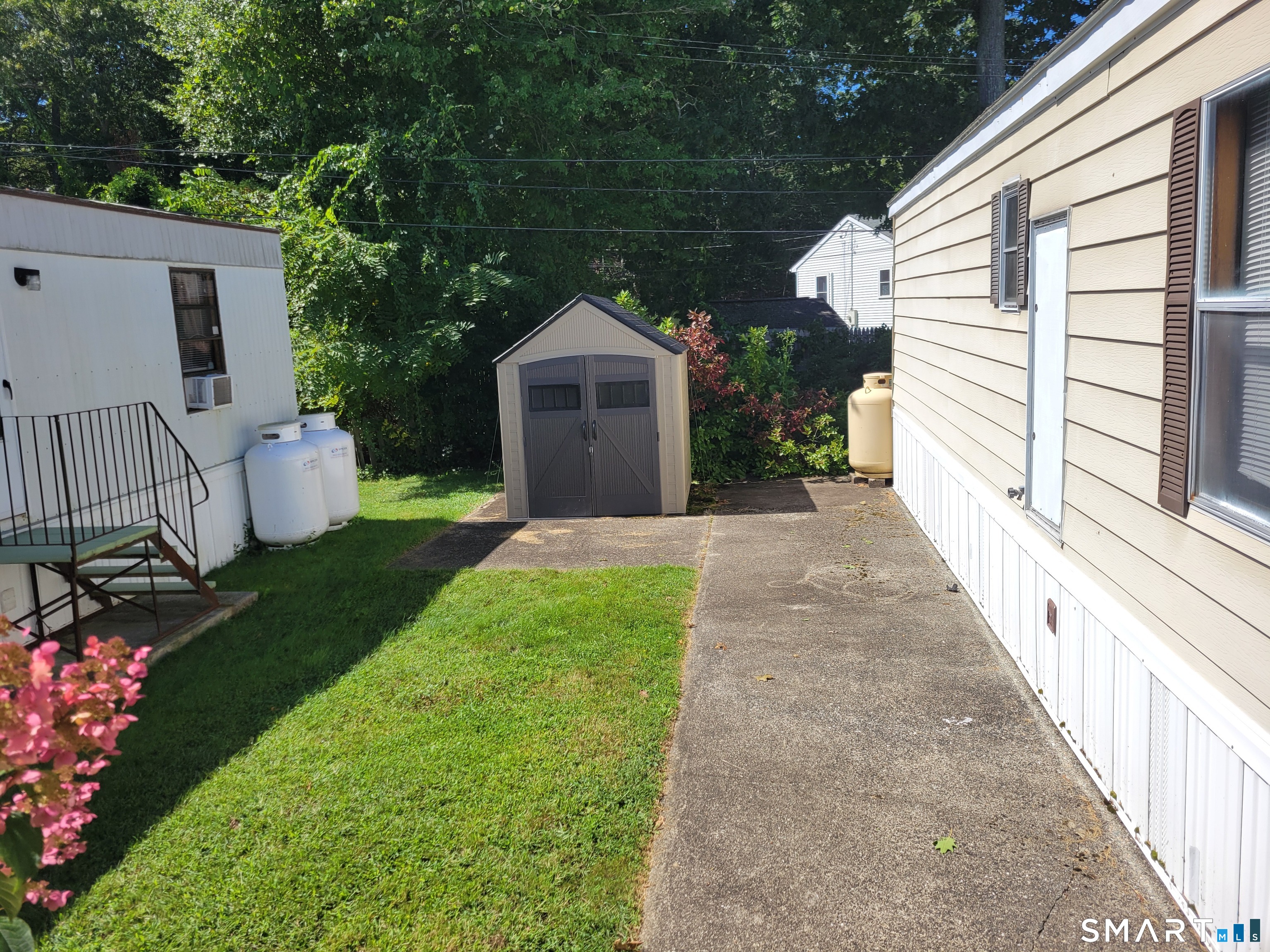 91 Buddington Road Groton, CT 06340 - Photo 13 of 14 View from deck to side yard.