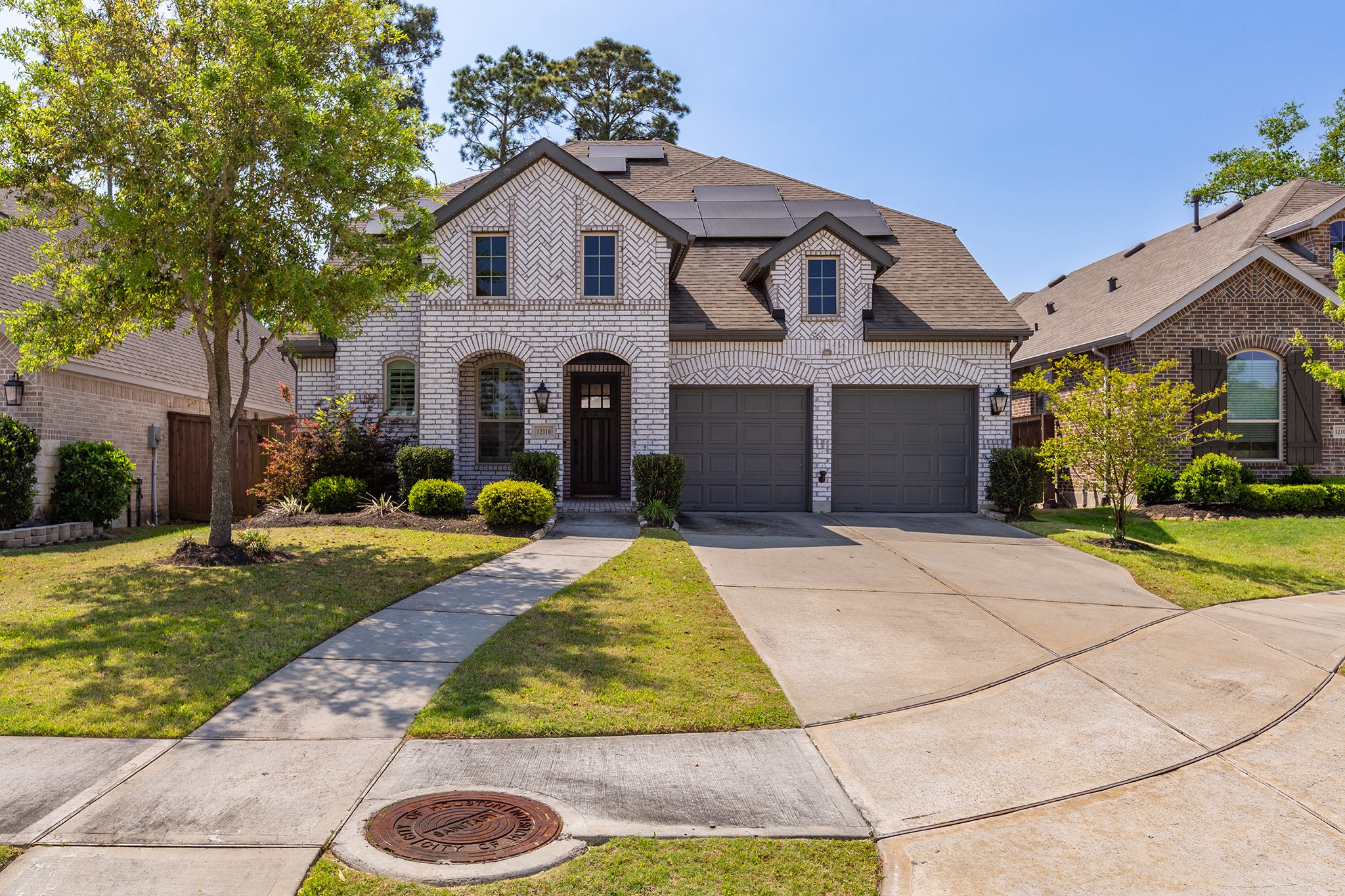 12110 Woodnote Lane Humble, TX 77346 - Photo 2 of 36 a front view of a house with garden