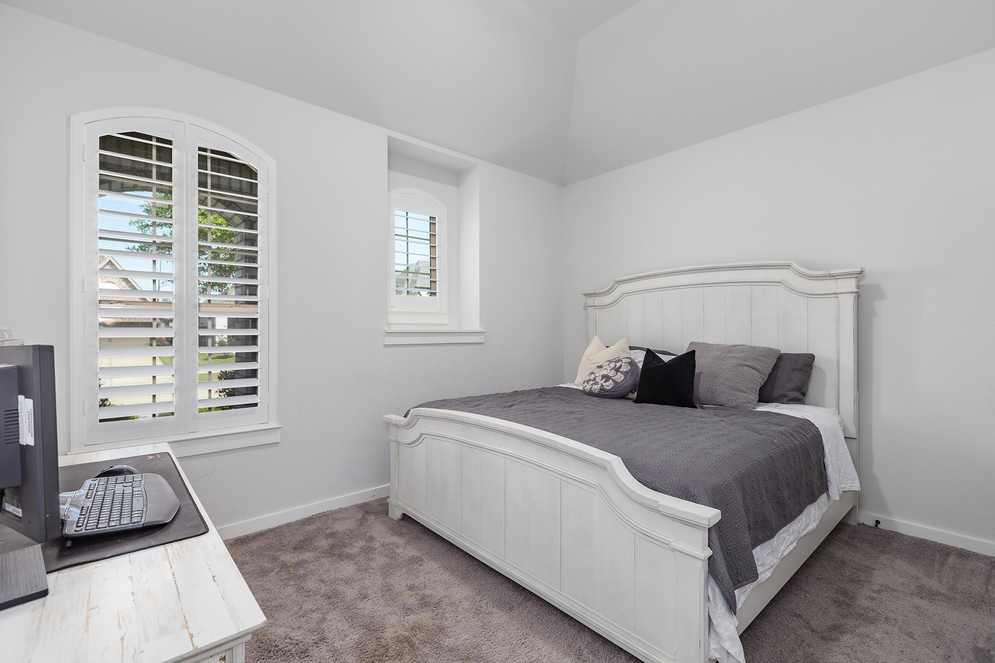 12110 Woodnote Lane Humble, TX 77346 - Photo 23 of 36 a bedroom with a bed and a window