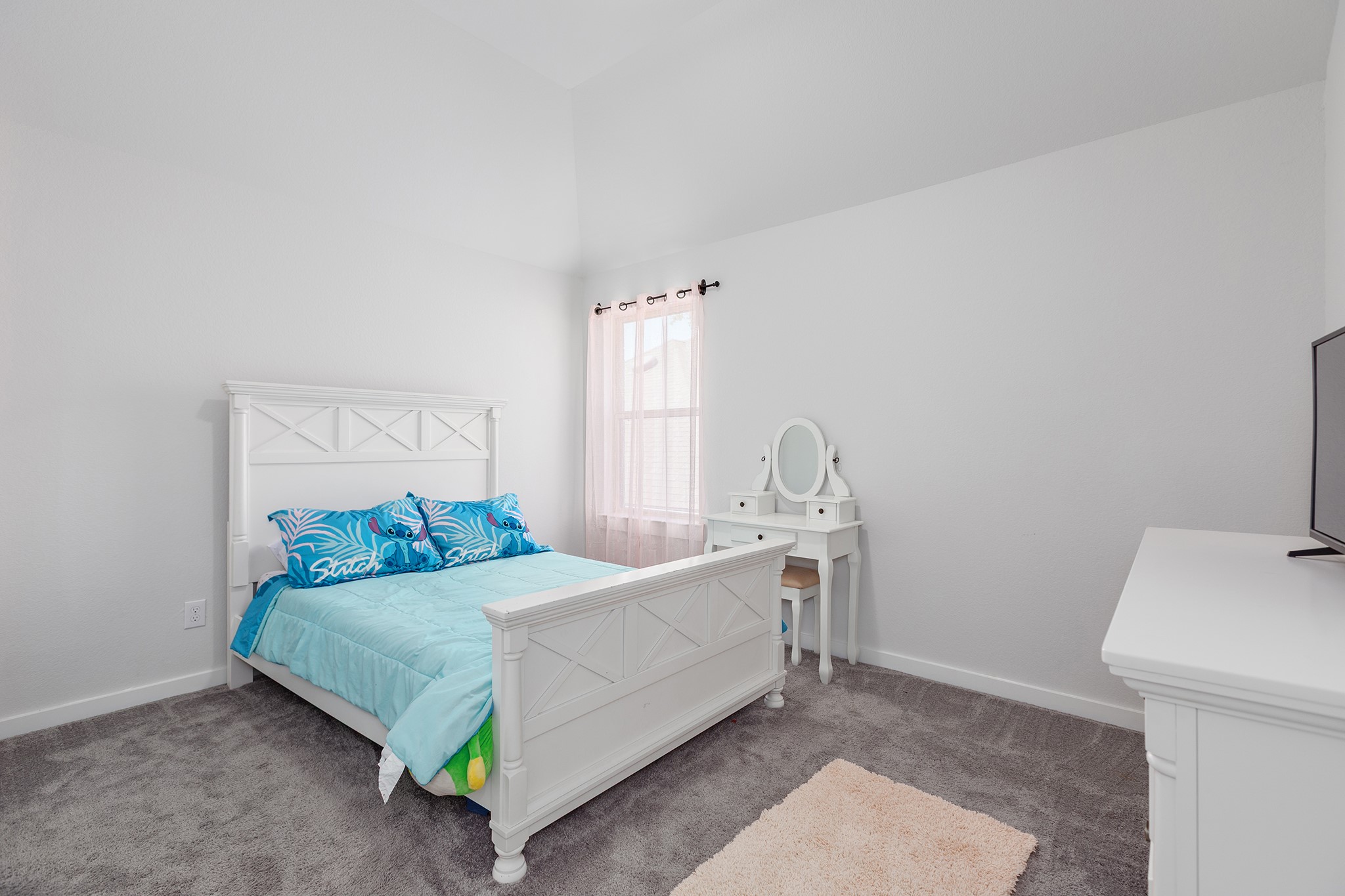 12110 Woodnote Lane Humble, TX 77346 - Photo 27 of 36 a bedroom with a bed and a table
